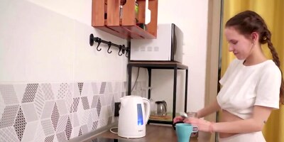 Russian cutie with natural tits masturbates in the kitchen