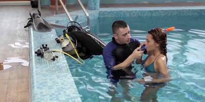 Alexis Brill and diving instructor are making out by the pool
