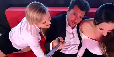 Blonde and brunette are filming themselves while sharing a guy