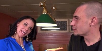 Bald guy analyzes hot brunette on the table for pool