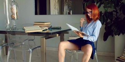 Cute redhead strips down and takes a break from studying