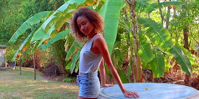 Ebony teen Karo Lander solo caresses herself in the garden