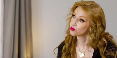 Two inekd blondes are making out on the massage table