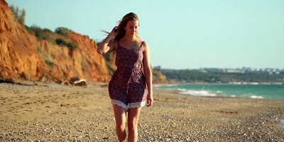 Sexy Elison with big natural tits caresses herself on the shore