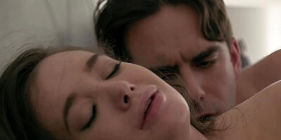 Man and comely brunette tenderly copulate in bedroom