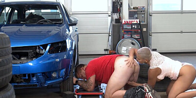 Short haired blonde MILF is licking the car mechanic