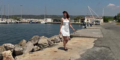 Melany gives a blowjob while relaxing on a public place