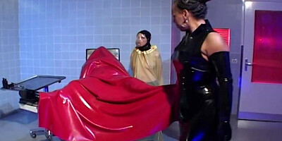 Fetish scene with lots of latex and some intense fisting