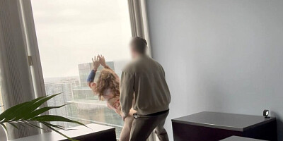 MILF boss fucked against her office window