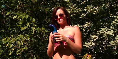 Sunbathing by the pool and rubbing her nice shaved muff