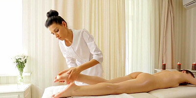 Lesbian masseuse is playing with the clit of a client