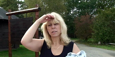 Outdoors screwing for a busty GILF by a young blond man