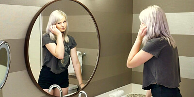 Petite Emma Price undressed and caresses herself in the bathroom