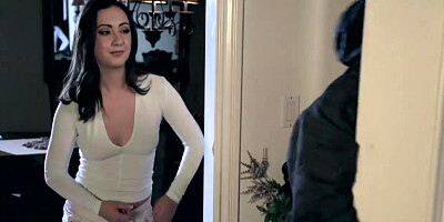 Jenna Sativa and Lily Jordan on a white leather sofa in a lesbian scene together