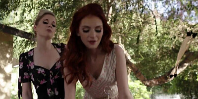 Charlotte Stokely and Maya Kendrick licking while outside