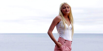 Sexy blonde Olivia Devine fondles herself on the shore