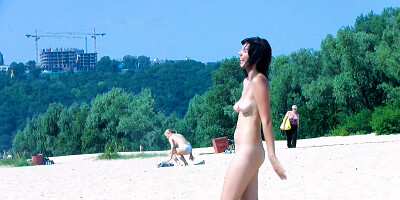 Hot nudist teen filmed by voyeur as she sits naked outside