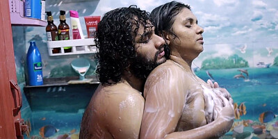 Chesty brunette getting wet in the shower with her man