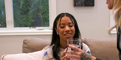 Blonde and ebony babe in a lesbian action on the floor