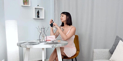 Brunette with short hair puts a toy in her wet opening