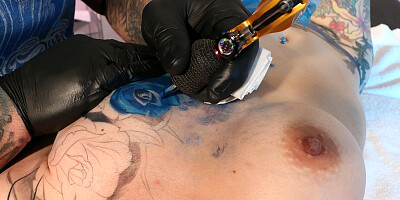 Marie Bossette Gets a Blue Rose Tattooed on Her Left Boob - AltErotic