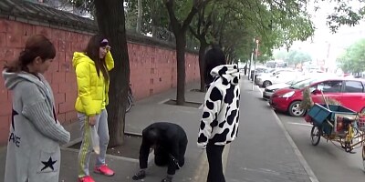 The slave was ridden outdoor and kneel down on the road while slapped