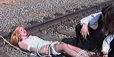 Ticklish Damsel Tickled on Railroad Tracks (nylon bare feet tickling)