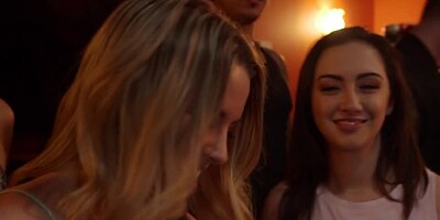 A hot blonde is in the bathroom at a party where she is sucking dick